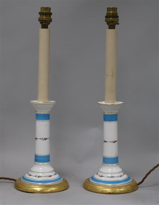A pair of Victorian blue and white candlesticks adapted as lamps